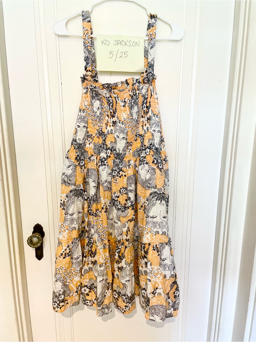 Smocked Peach Sundress with abstract faces and Floral Print